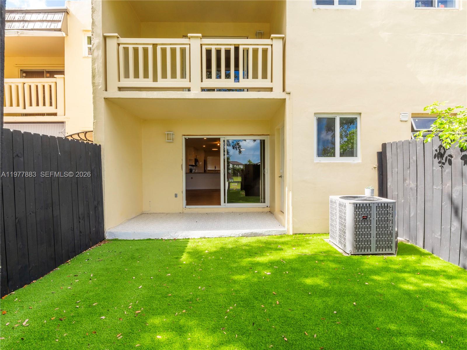 8329 Southwest 137th Avenue, Unit 8329 Miami, FL 33183 - Photo 23 of 33 front view of a house with a yard