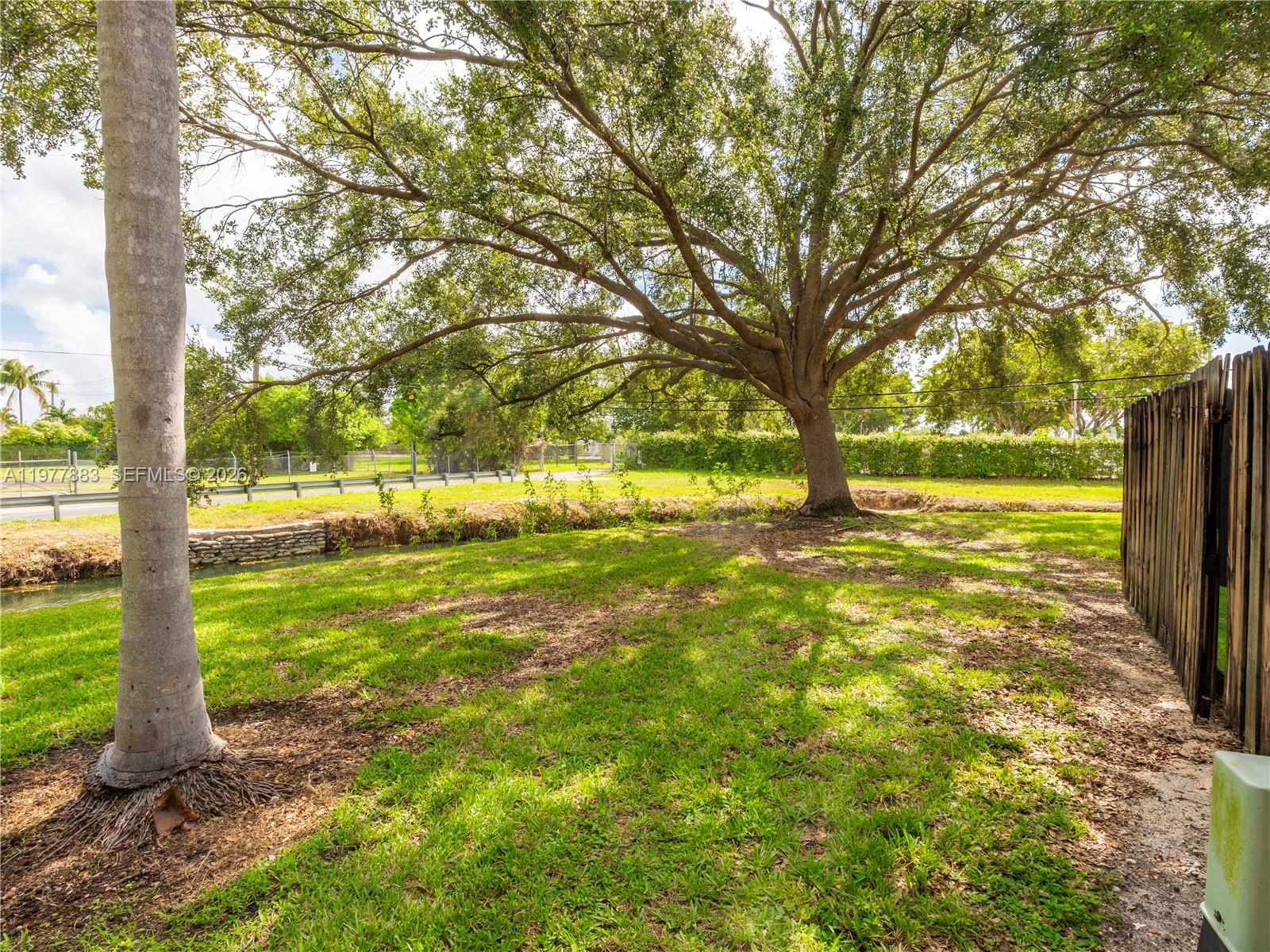8329 Southwest 137th Avenue, Unit 8329 Miami, FL 33183 - Photo 28 of 33 a view of a yard with large trees