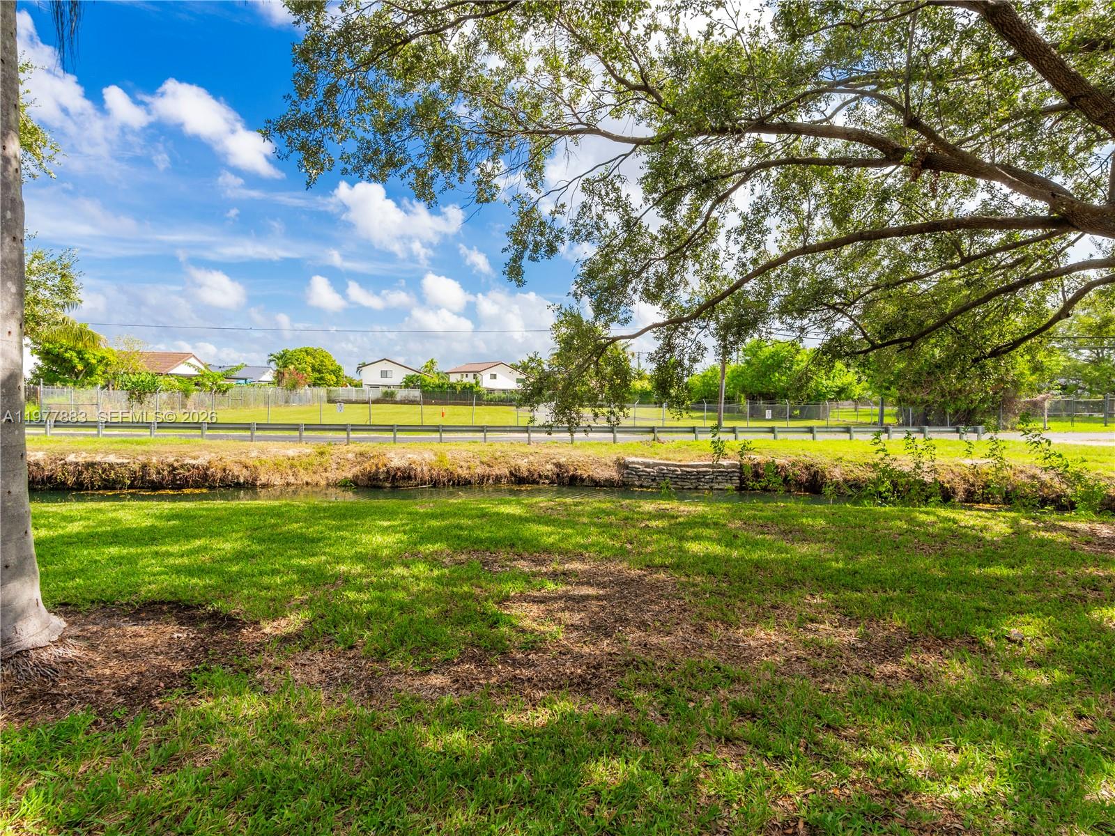 8329 Southwest 137th Avenue, Unit 8329 Miami, FL 33183 - Photo 29 of 33 a view of an outdoor space and yard