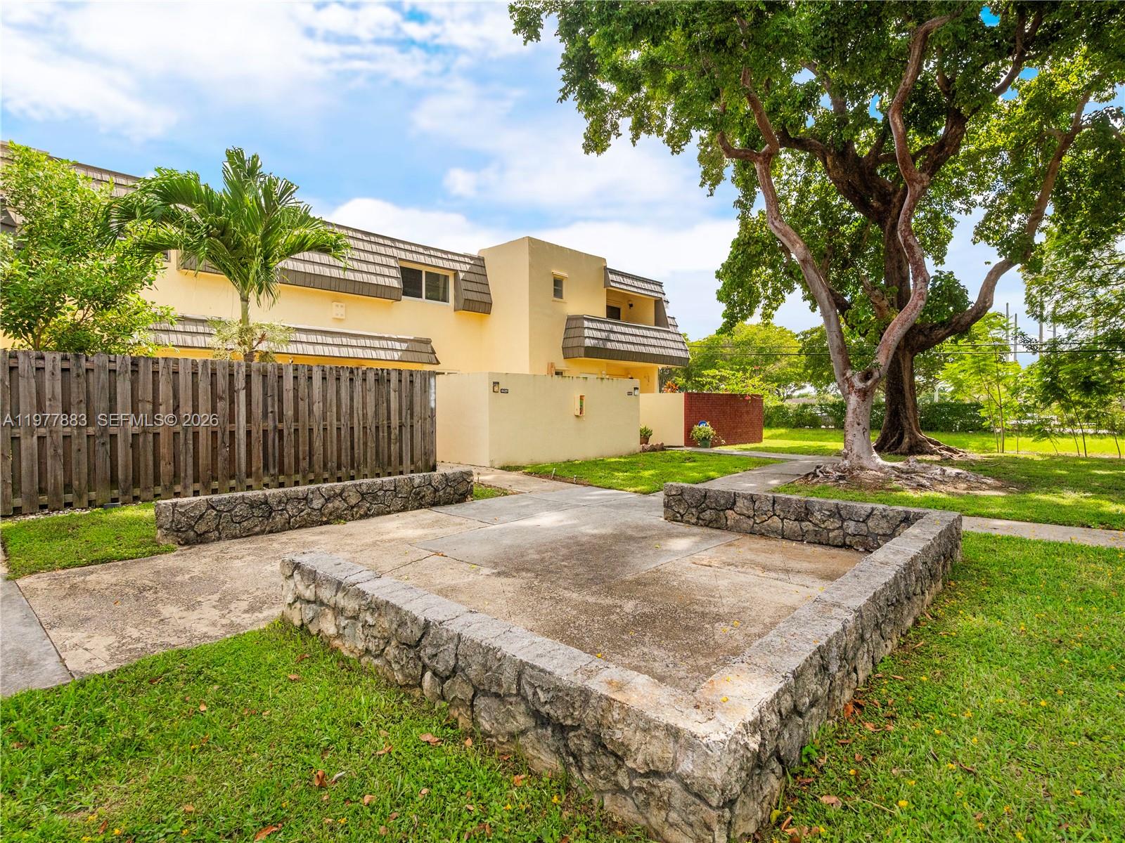 8329 Southwest 137th Avenue, Unit 8329 Miami, FL 33183 - Photo 30 of 33 a view of a backyard with a small cabin