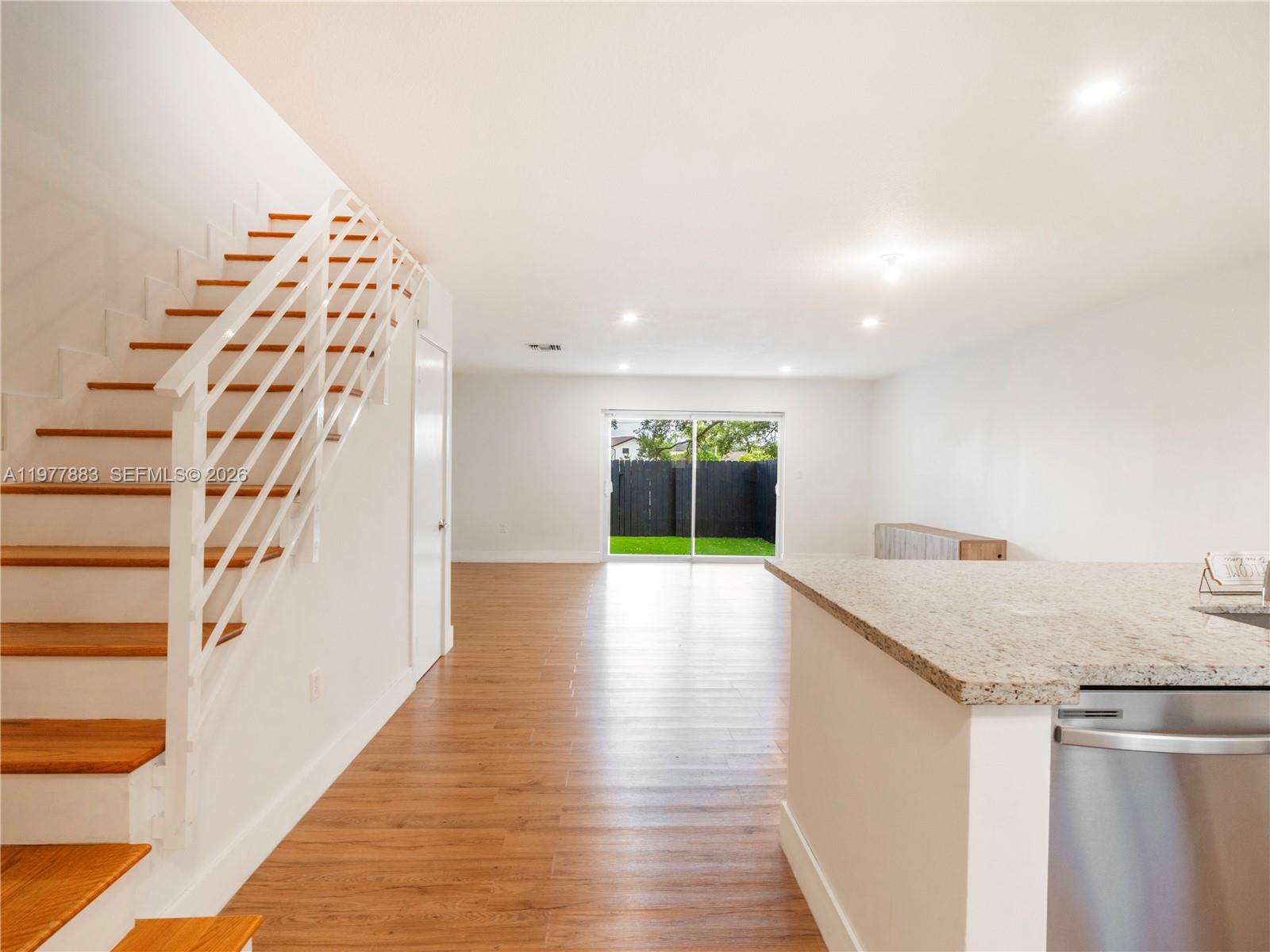 8329 Southwest 137th Avenue, Unit 8329 Miami, FL 33183 - Photo 4 of 33 a view of livingroom with kitchen