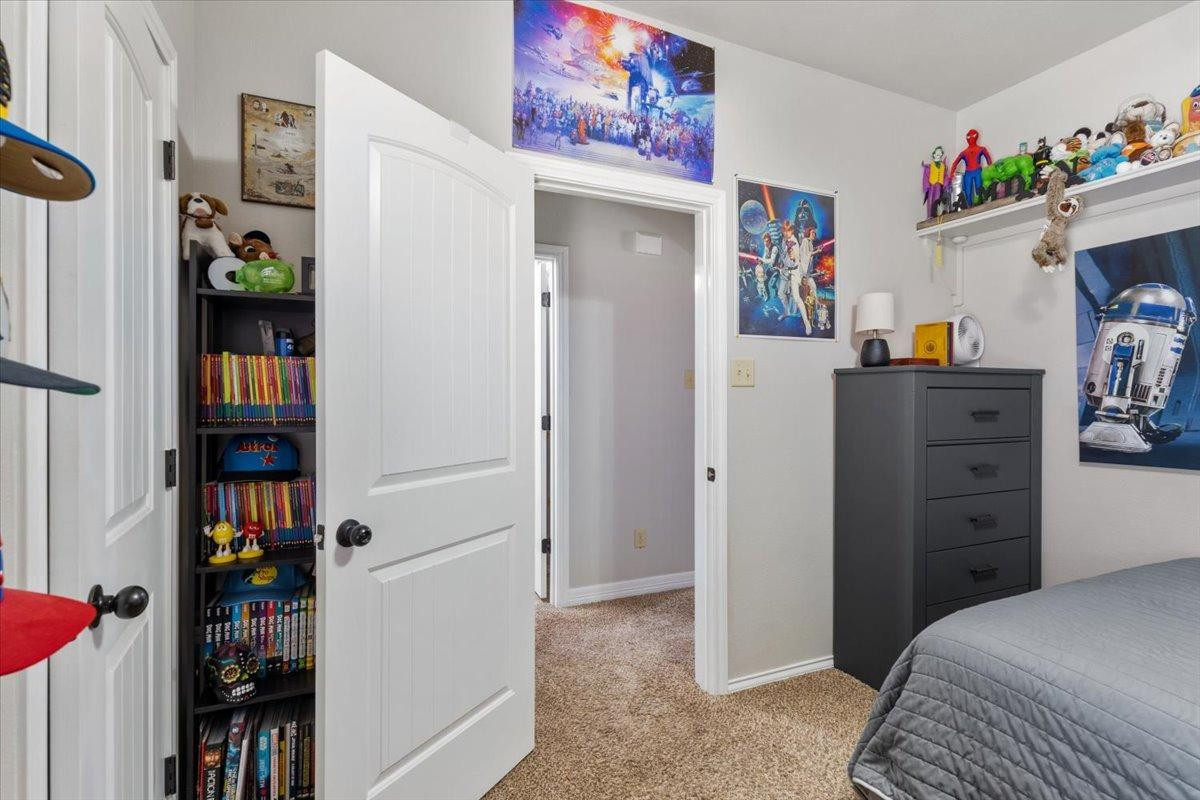 9804 Juneau Avenue Lubbock, TX 79424 - Photo 20 of 30 a bedroom with a bed and closet