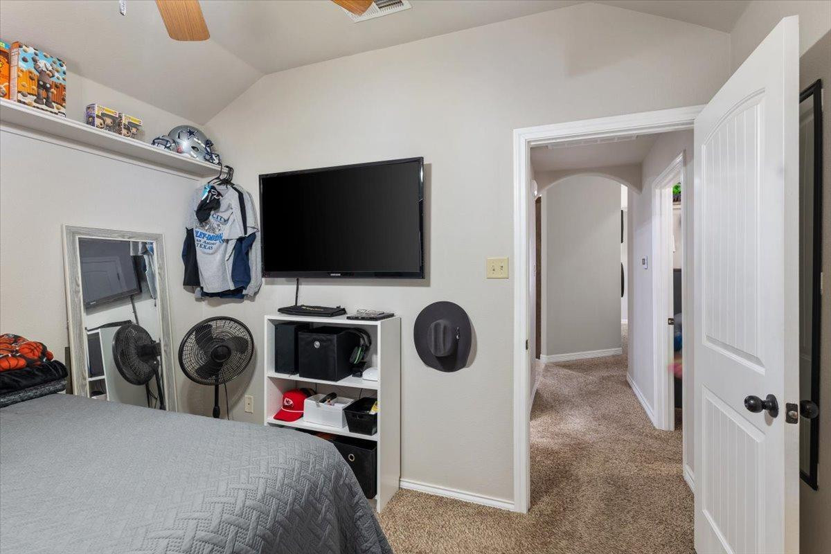 9804 Juneau Avenue Lubbock, TX 79424 - Photo 23 of 30 a view of a bedroom with washer and dryer
