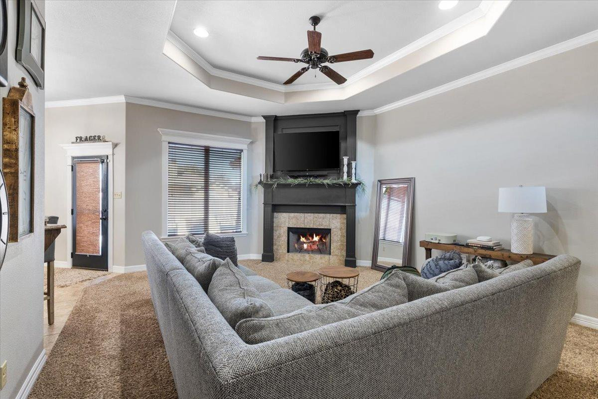 9804 Juneau Avenue Lubbock, TX 79424 - Photo 6 of 30 a living room with furniture and a fireplace