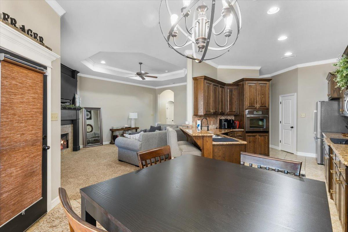 9804 Juneau Avenue Lubbock, TX 79424 - Photo 10 of 30 a living room with fireplace furniture and a wooden floor