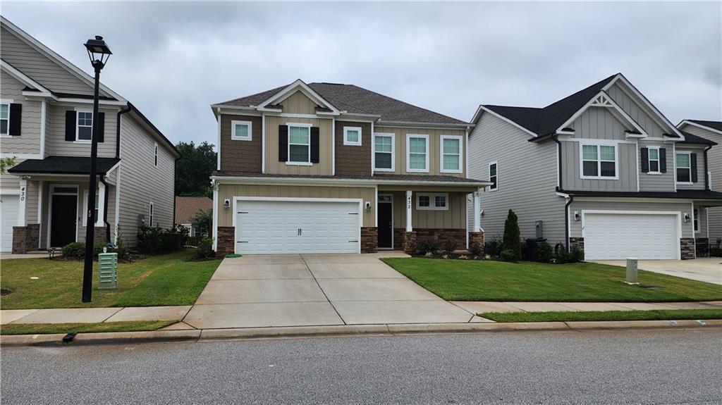 432 Longmeadow Drive Grovetown, GA 30813 - Photo 1 of 1 a front view of a house with a yard and garage