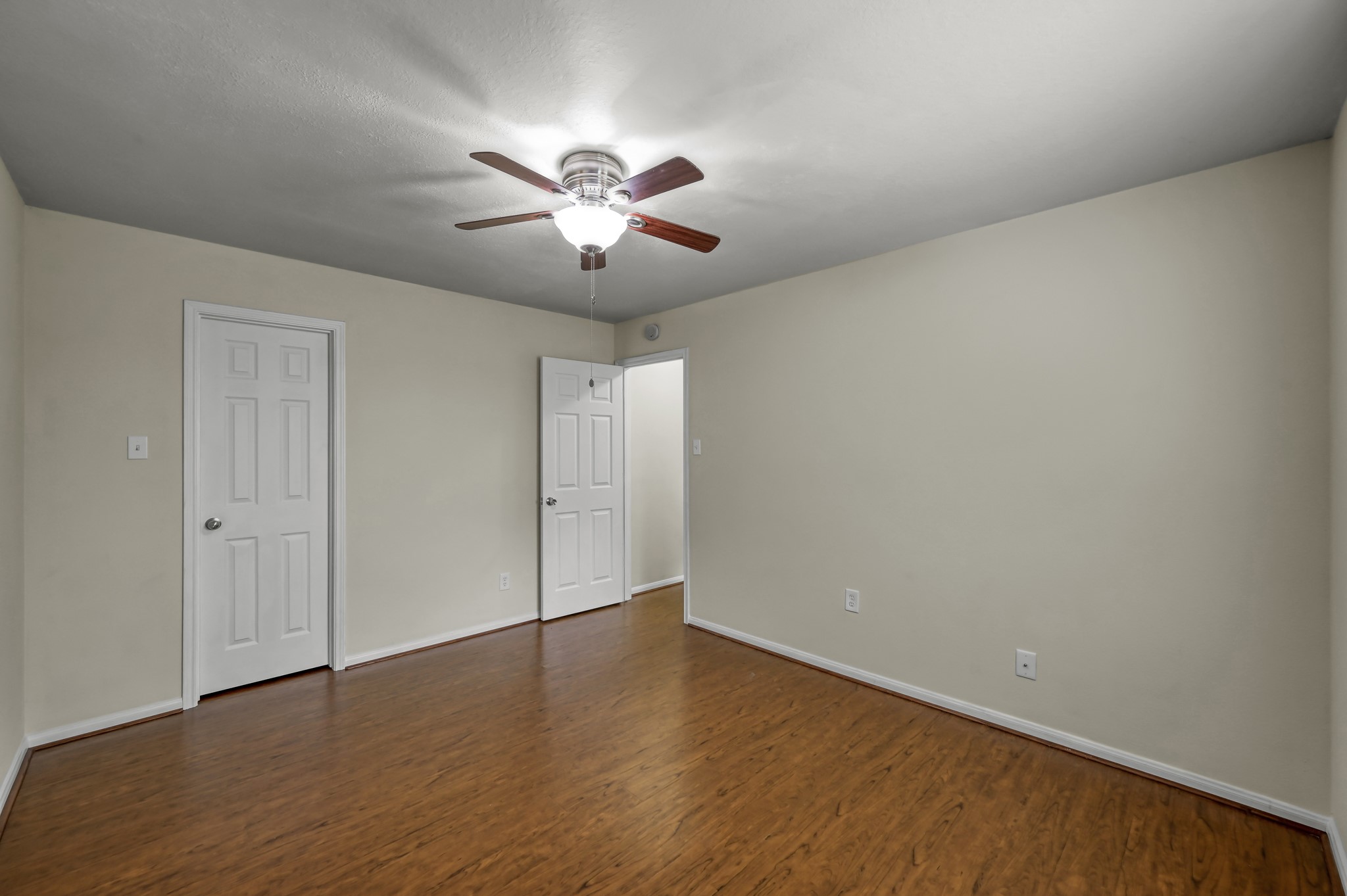 631 Timberstand Lane Spring, TX 77373 - Photo 30 of 38 Another view of the secondary bedroom highlights the large closet, neutral finishes, and continued laminate flooring throughout.