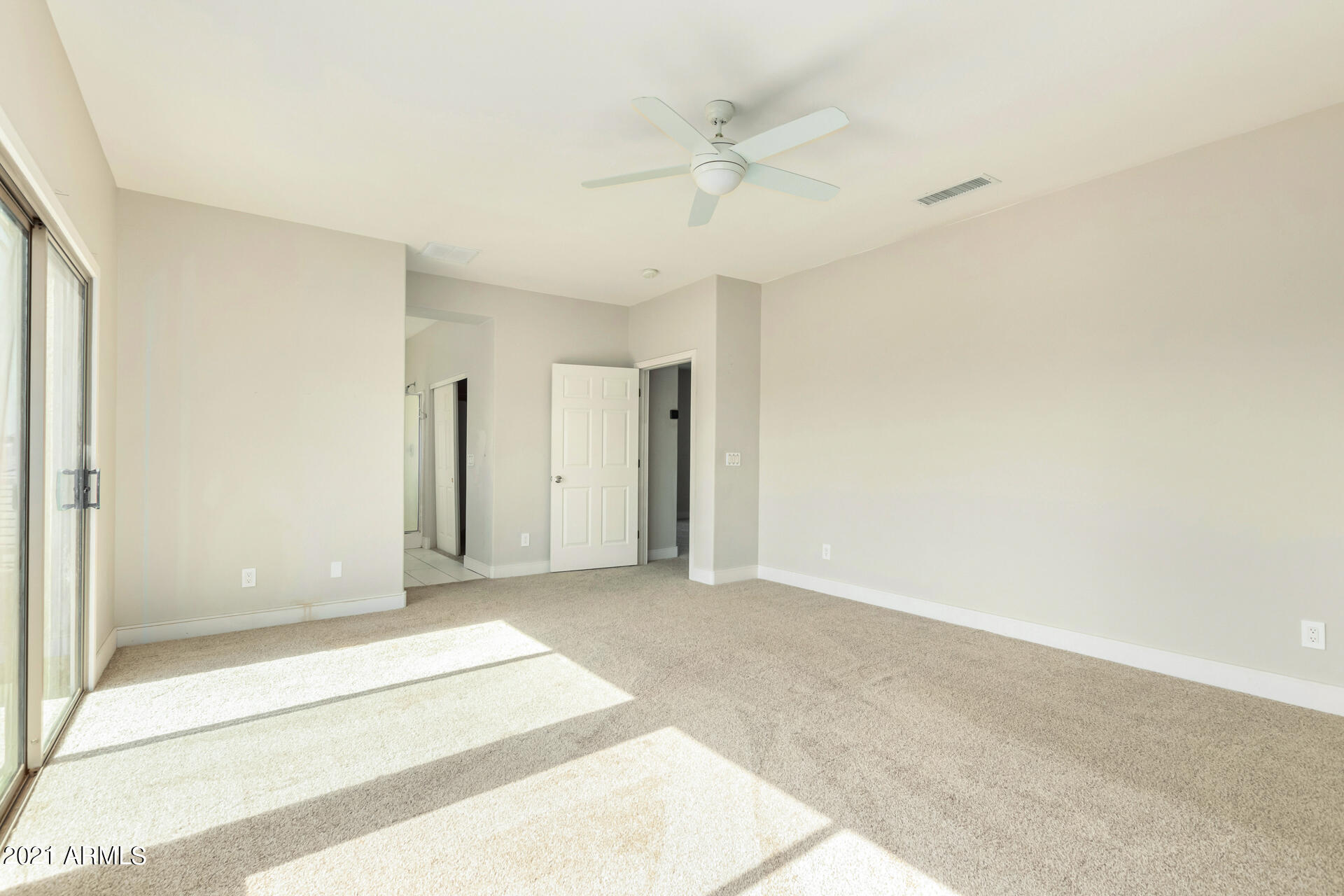 5505 West Pecan Road Laveen, AZ 85339 - Photo 17 of 31 a view of a livingroom with a ceiling fan and window