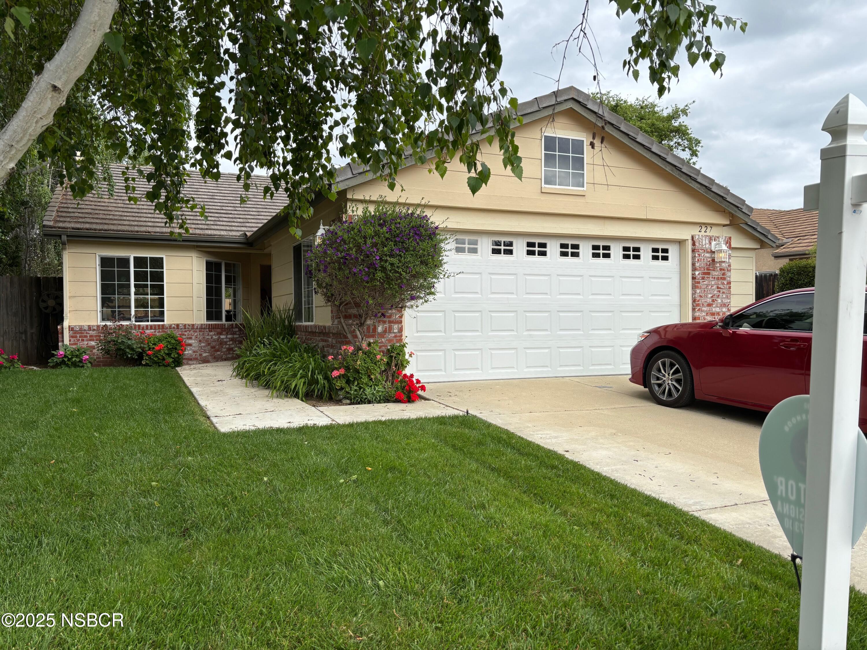 a view of a house with a back yard
