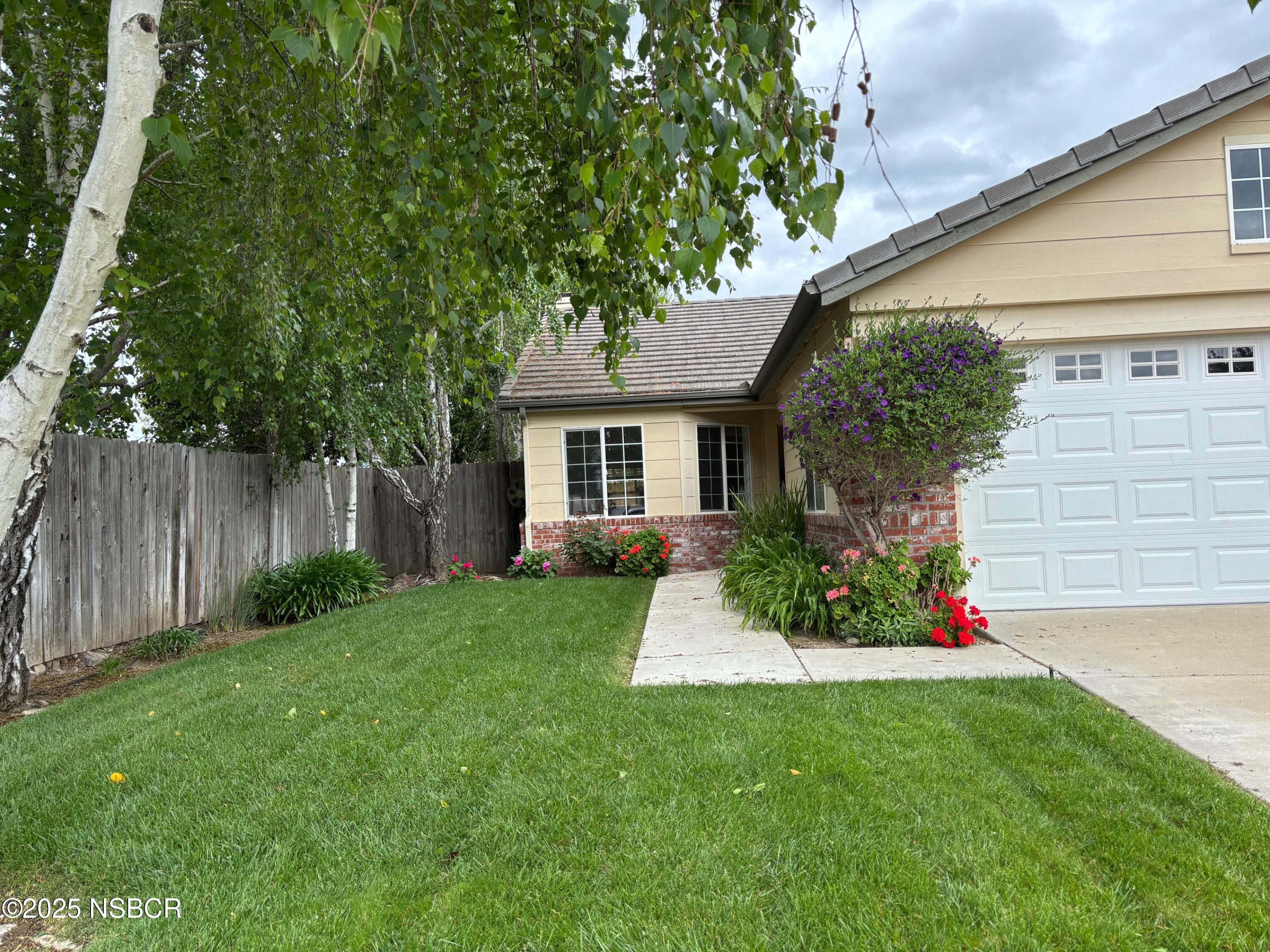 227 Valley Dairy Road Buellton, CA 93427 - Photo 2 of 10 a front view of a house with a yard and tree