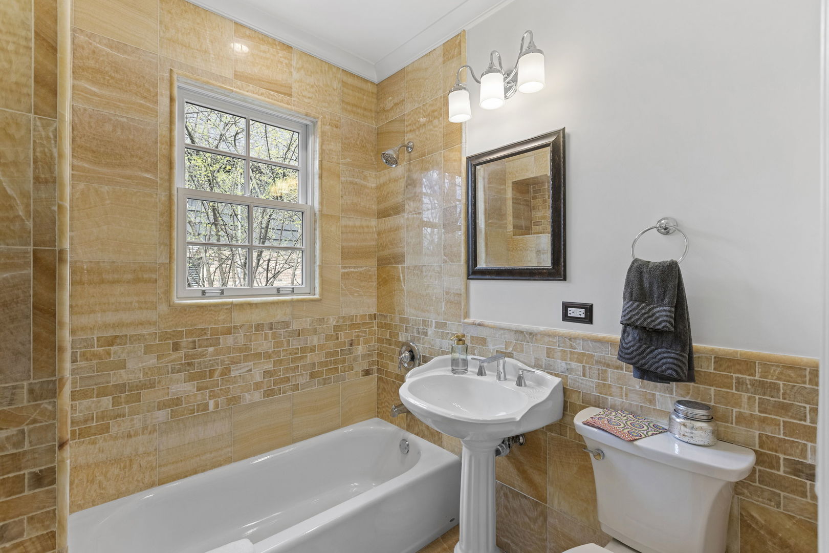 91 Wagner Road Northfield, IL 60093 - Photo 14 of 32 a bathroom with a sink toilet and shower