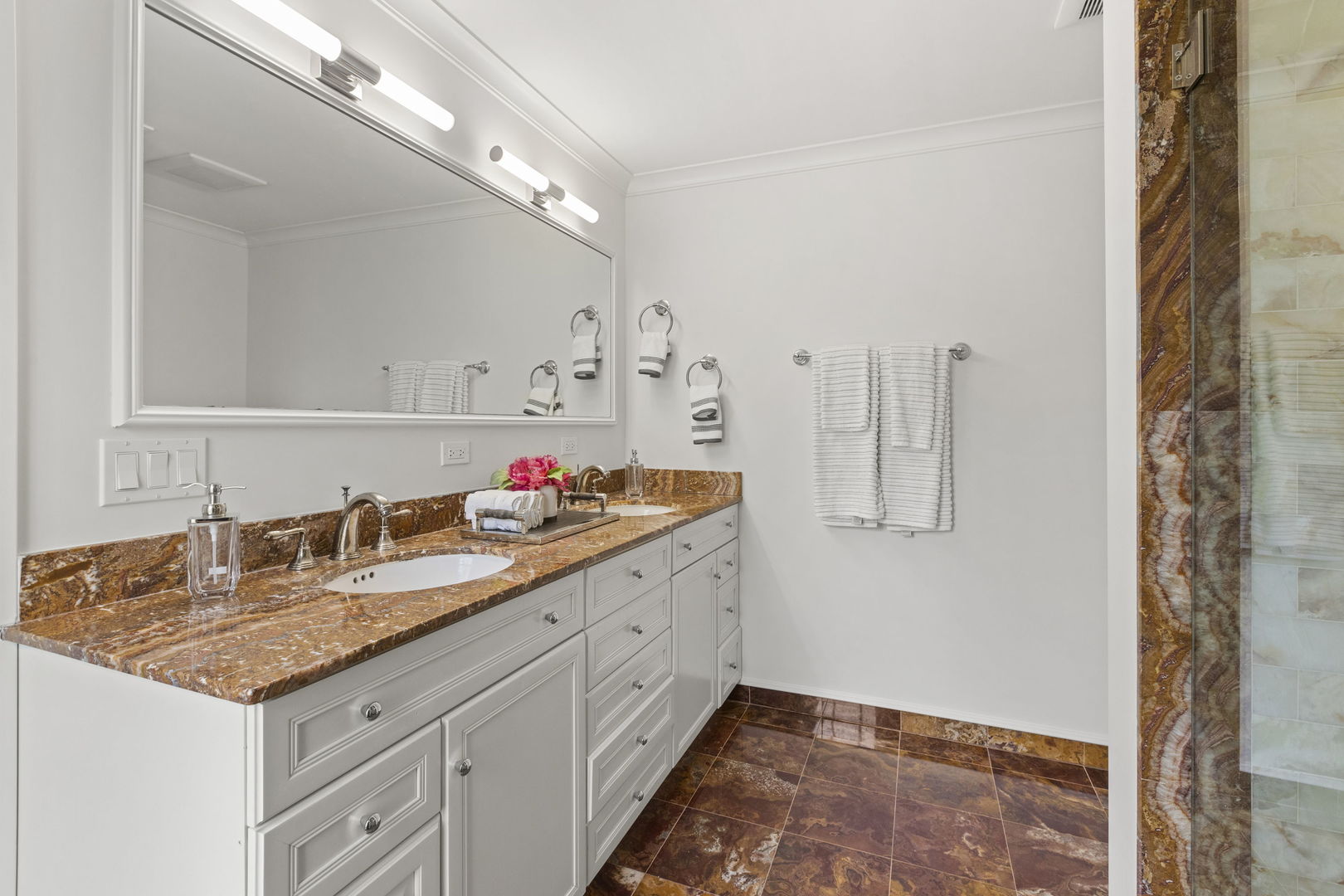 91 Wagner Road Northfield, IL 60093 - Photo 19 of 32 a bathroom with a granite countertop sink and a mirror