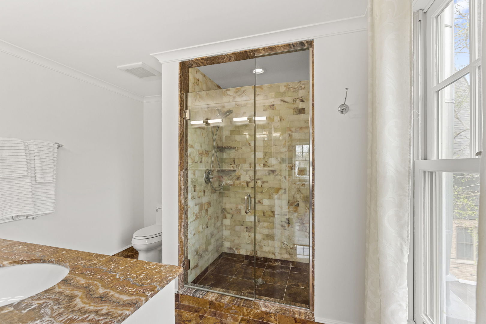 91 Wagner Road Northfield, IL 60093 - Photo 20 of 32 a bathroom with a shower