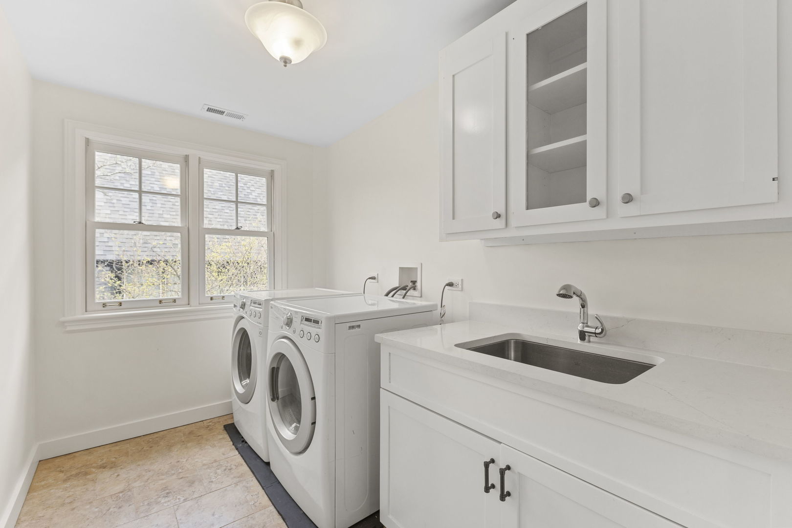 91 Wagner Road Northfield, IL 60093 - Photo 28 of 32 a utility room with sink dryer and washer