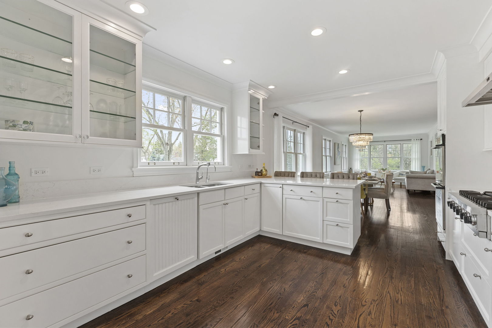 91 Wagner Road Northfield, IL 60093 - Photo 10 of 32 a open kitchen with white cabinets and wooden floor