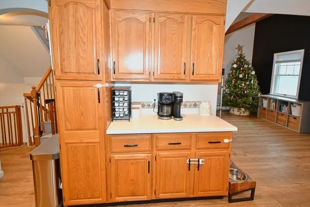 a dining room with furniture and wooden floor
