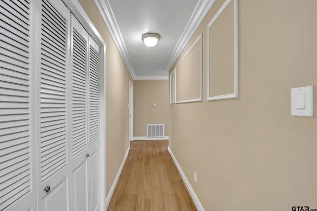 a kitchen with white cabinets a sink and dishwasher