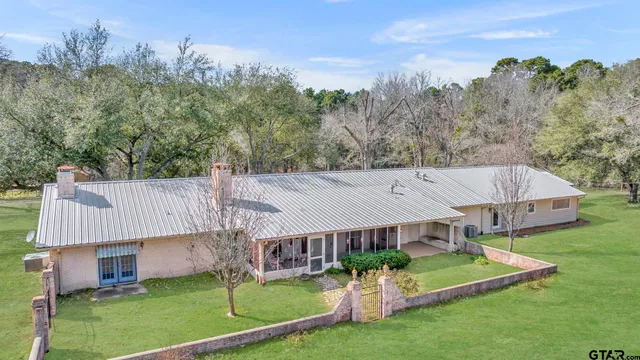 a view of a brick house with a wooden door