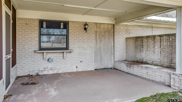 a view of a livingroom with a dinning table and chairs