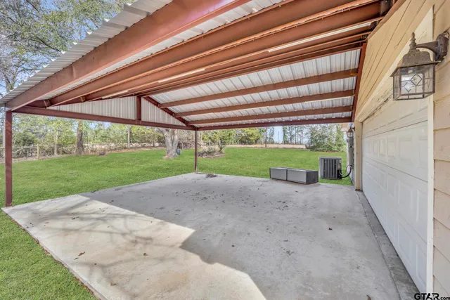 a view of grassy field with trees