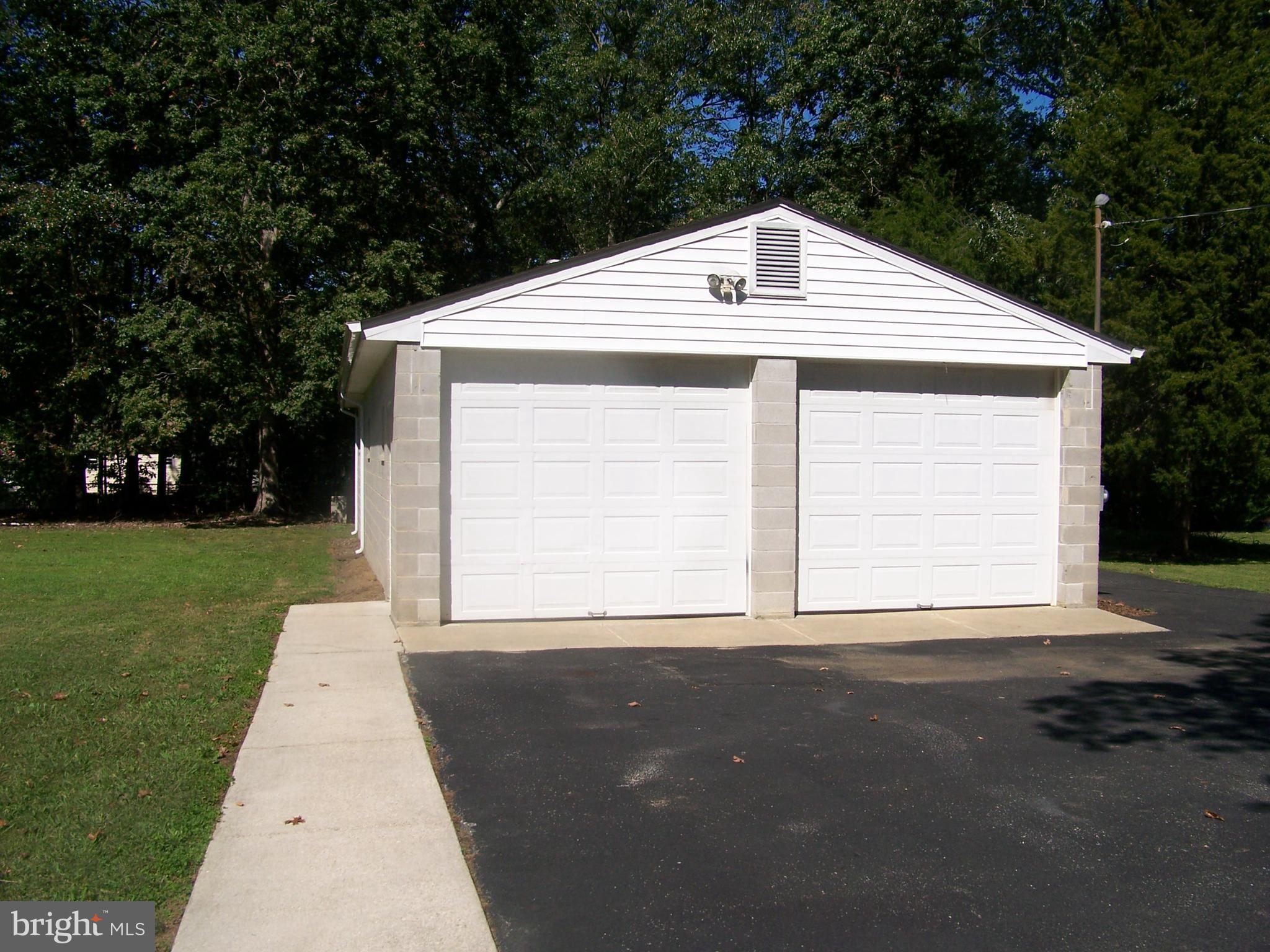 6225 Ripley Road La Plata, MD 20646 - Photo 35 of 41 Two Door Garage with wood stove