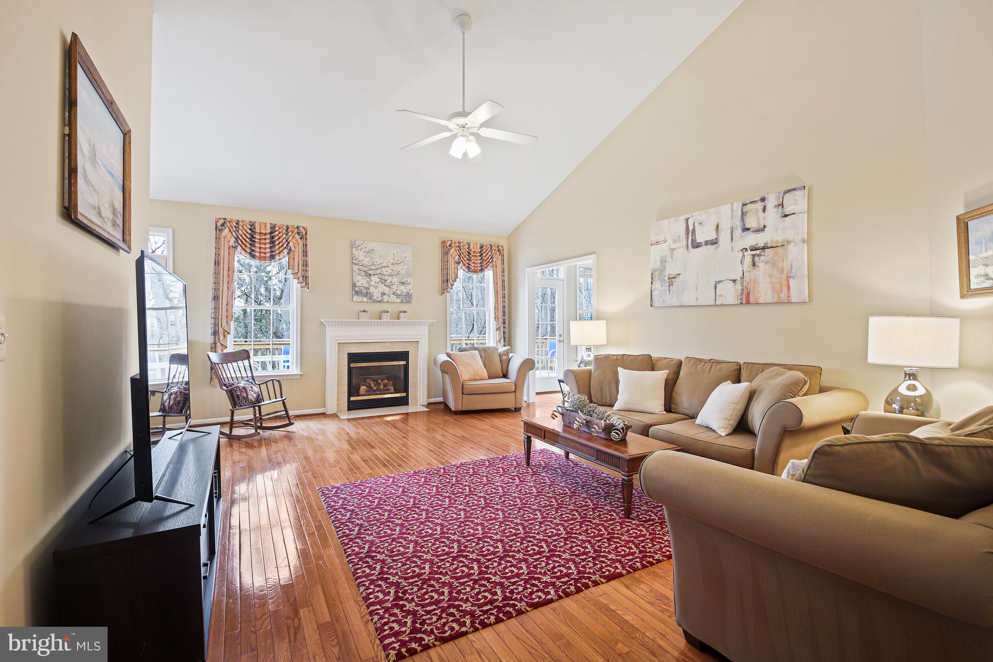 13558 Ryton Ridge Lane Gainesville, VA 20155 - Photo 27 of 63 Enjoy the gas fireplace and large windows.