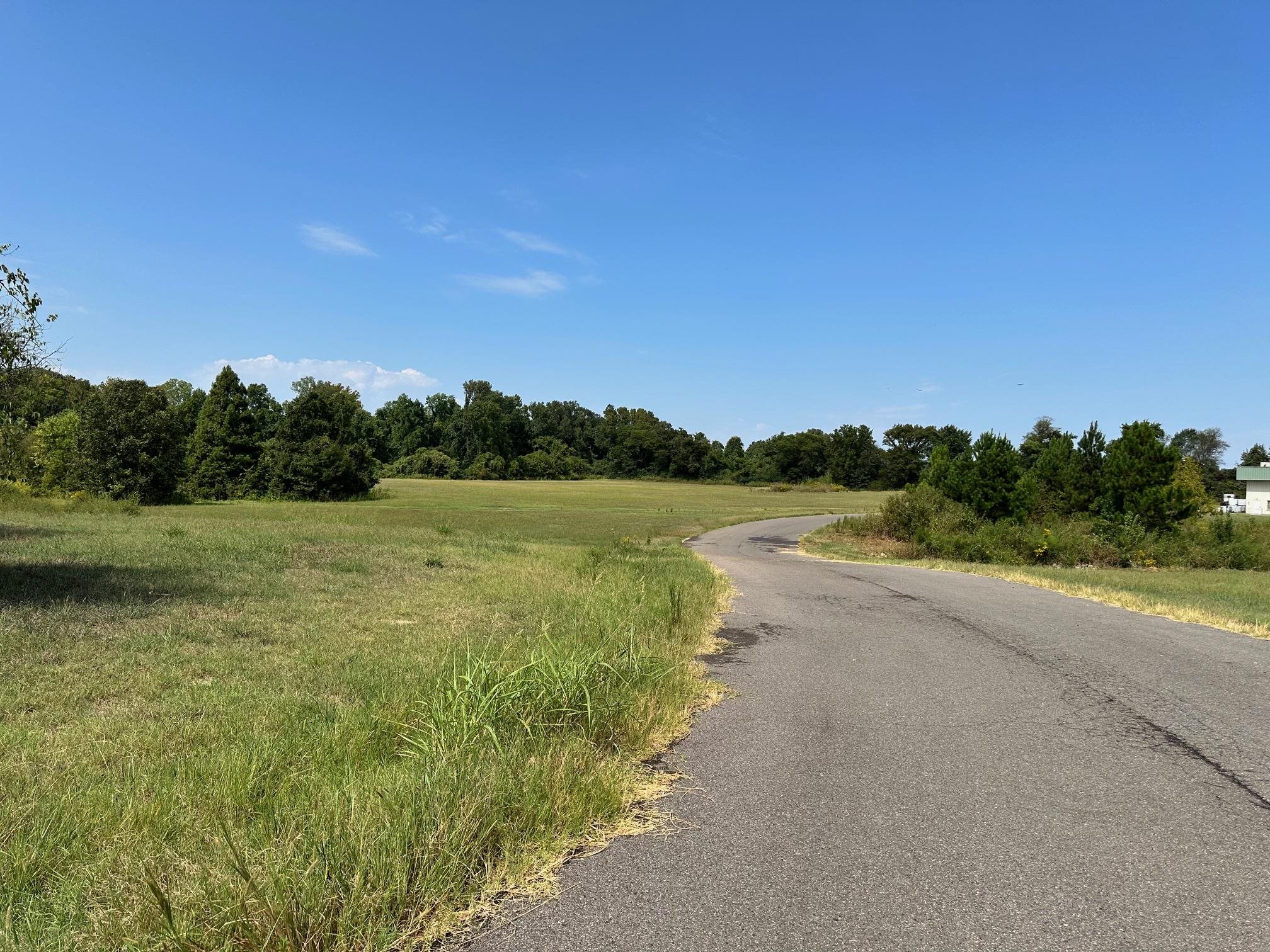 0 Shelby Road Millington, TN 38053 - Photo 2 of 3 a view of a lake with houses in the background