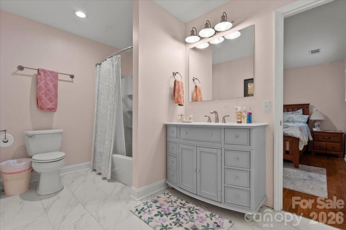 209 Fairway Road Cheraw, SC 29520 - Photo 20 of 48 a bathroom with a sink vanity and a mirror