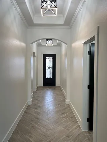 wooden floor with a hallway