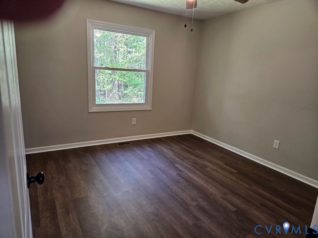 27368 Prince Edward Highway Rice, VA 23966 - Photo 9 of 18 a view of a room with wooden floor and windows