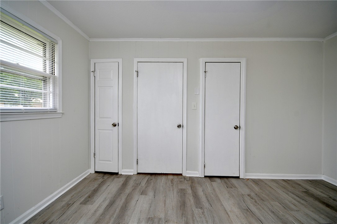 115 Stancil Road Anderson, SC 29625 - Photo 14 of 35 Well-lit room with wood-like vinyl flooring and convenient built-in closets.