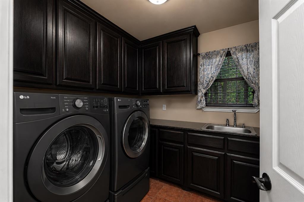 100 Manders Court Runaway Bay, TX 76426 - Photo 11 of 33 a kitchen with a sink a stove and cabinets