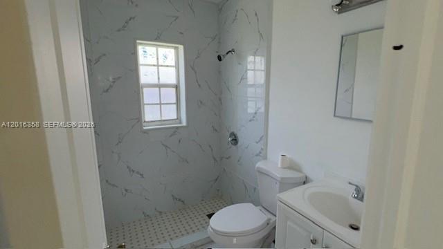 441 Southwest 10th Street, Unit 4 Miami, FL 33130 - Photo 18 of 18 a bathroom with a toilet sink vanity and shower
