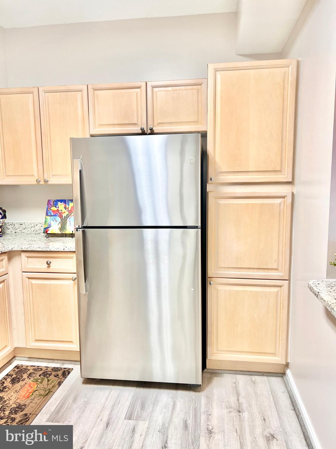 3200 North Leisure World Boulevard, Unit 314 Silver Spring, MD 20906 - Photo 19 of 42 a kitchen with a refrigerator and a stove