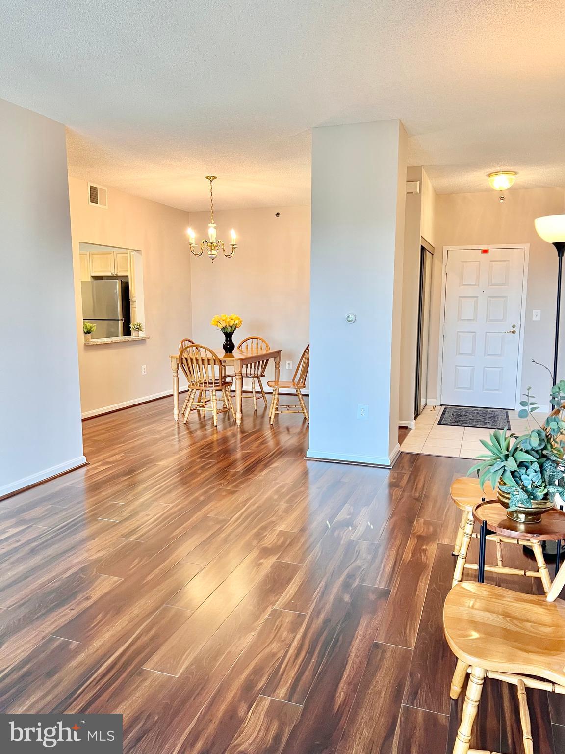 3200 North Leisure World Boulevard, Unit 314 Silver Spring, MD 20906 - Photo 5 of 42 a living room with furniture and a wooden floor