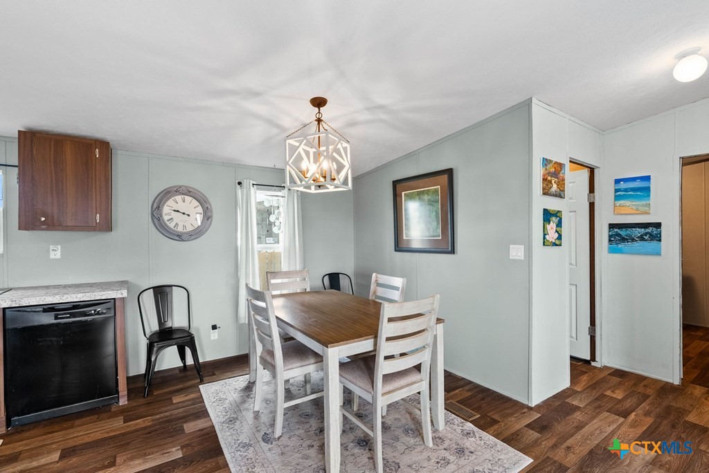 239 Allen M Parks Drive Rockport, TX 78382 - Photo 17 of 29 a view of a dining room with furniture and chandelier