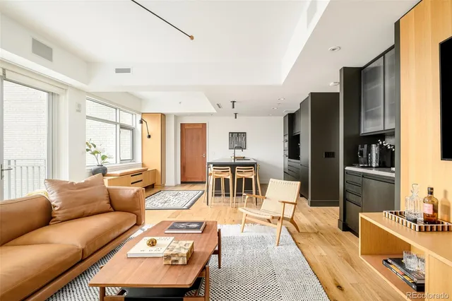 a living room with furniture and a table