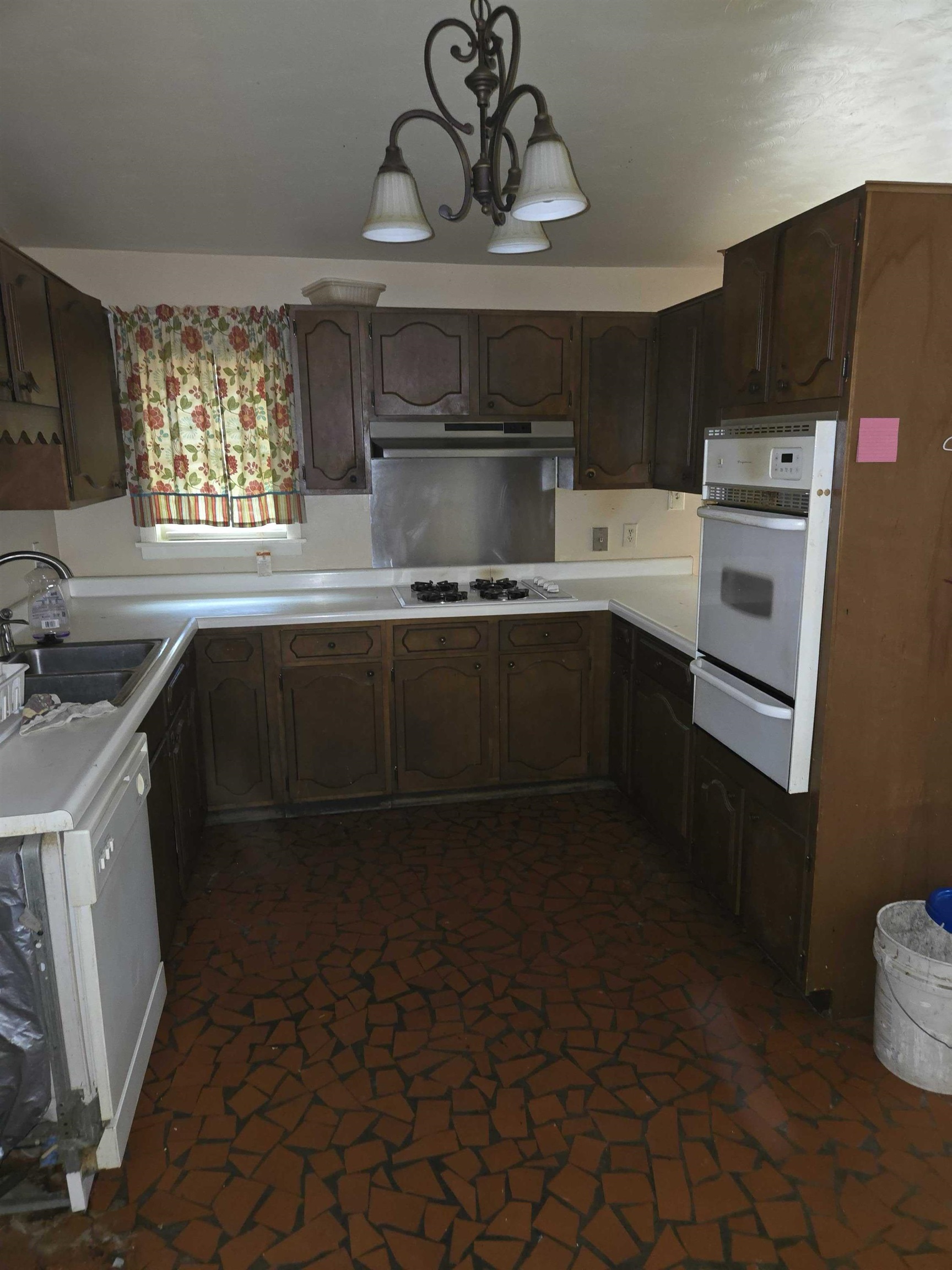 4898 Knight Arnold Road Memphis, TN 38118 - Photo 4 of 10 a kitchen with stainless steel appliances a sink stove and cabinets