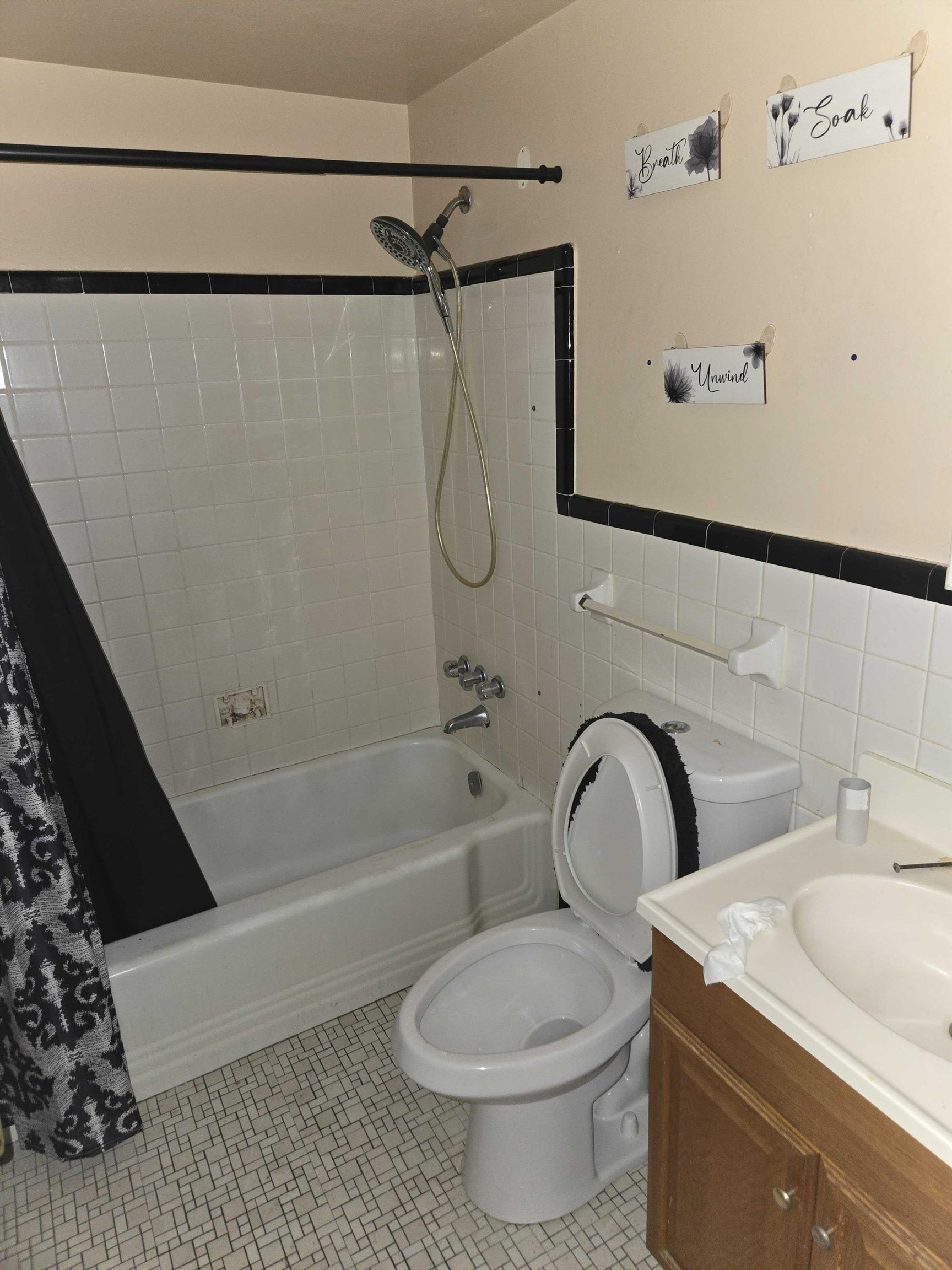 4898 Knight Arnold Road Memphis, TN 38118 - Photo 7 of 10 a bathroom with a sink toilet and shower