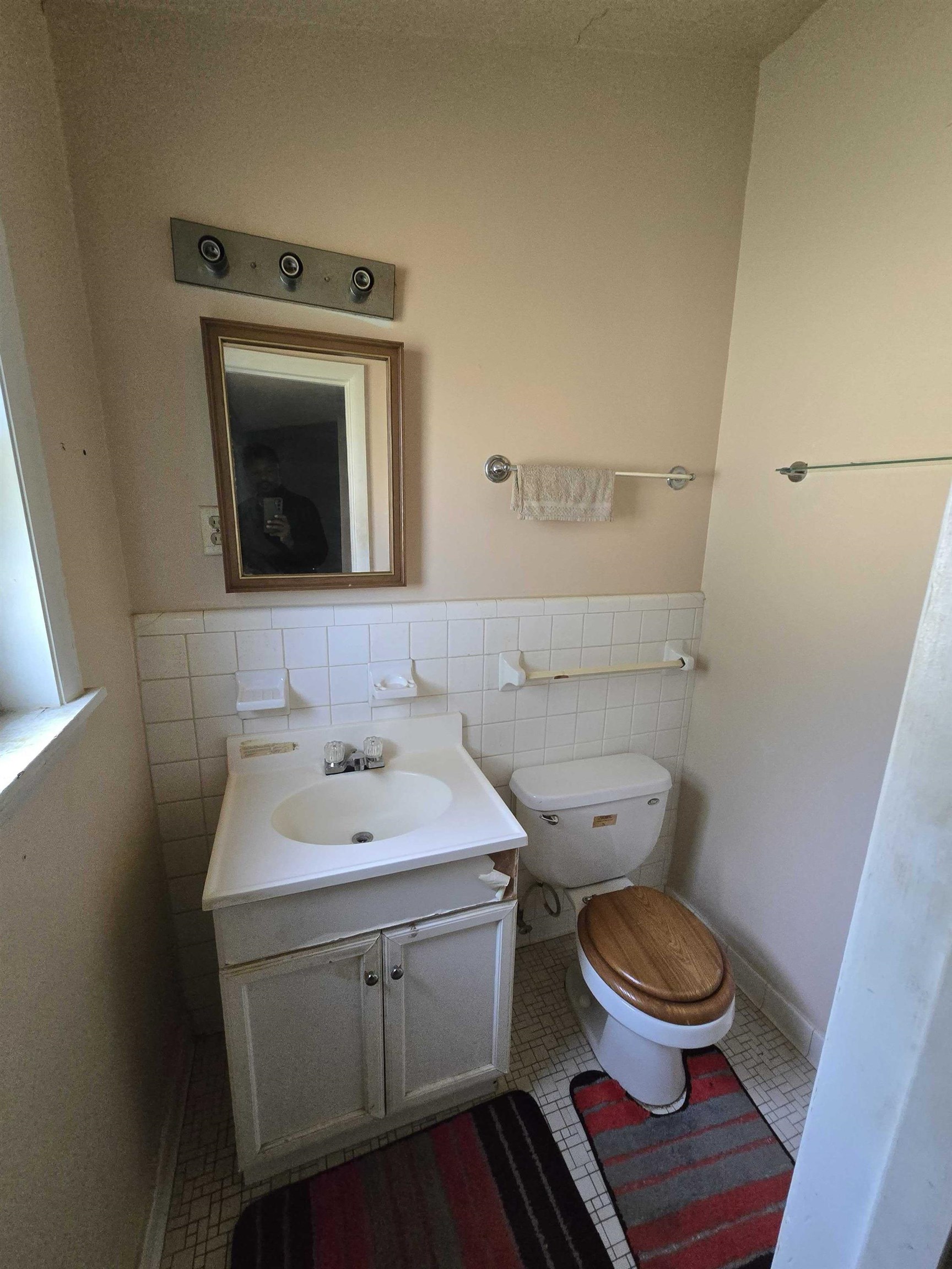 4898 Knight Arnold Road Memphis, TN 38118 - Photo 10 of 10 a bathroom with a toilet sink and mirror