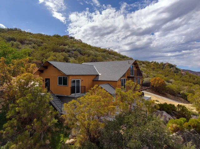 a view of house with mountain view