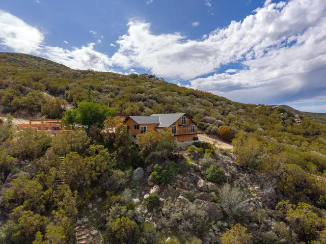 a view of a town with mountains in the background