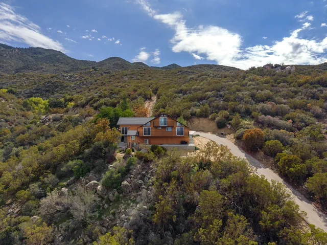 a view of a houses covered with snow