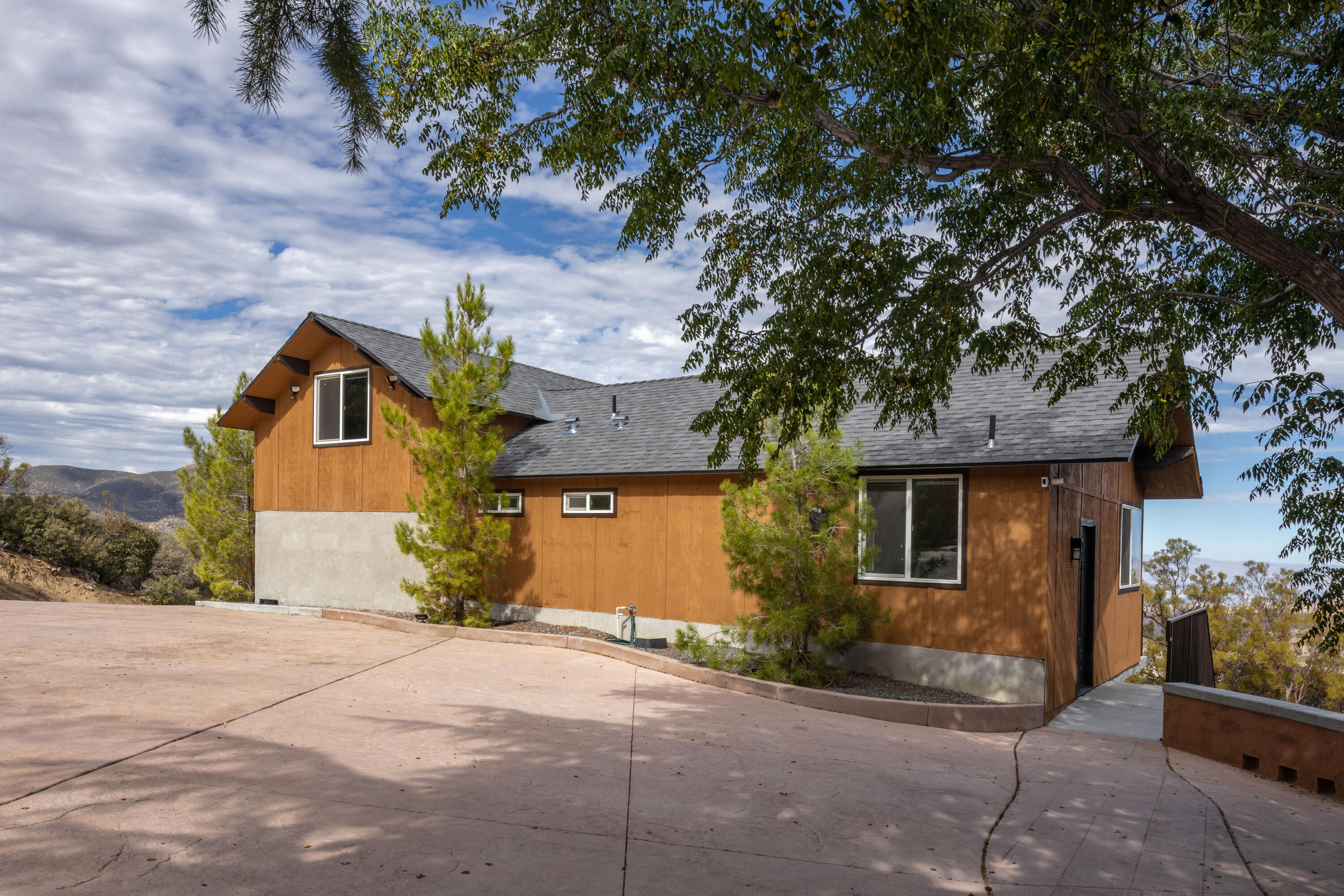 67195 Springcrest Drive Mountain Center, CA 92561 - Photo 34 of 67 a front view of a house with a yard and garage