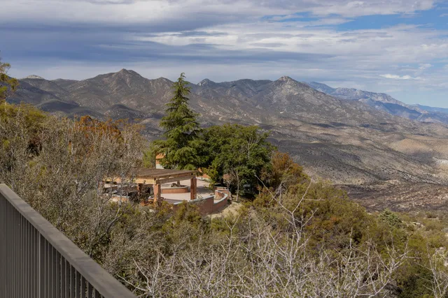 a bathroom with a toilet a sink and a mirror