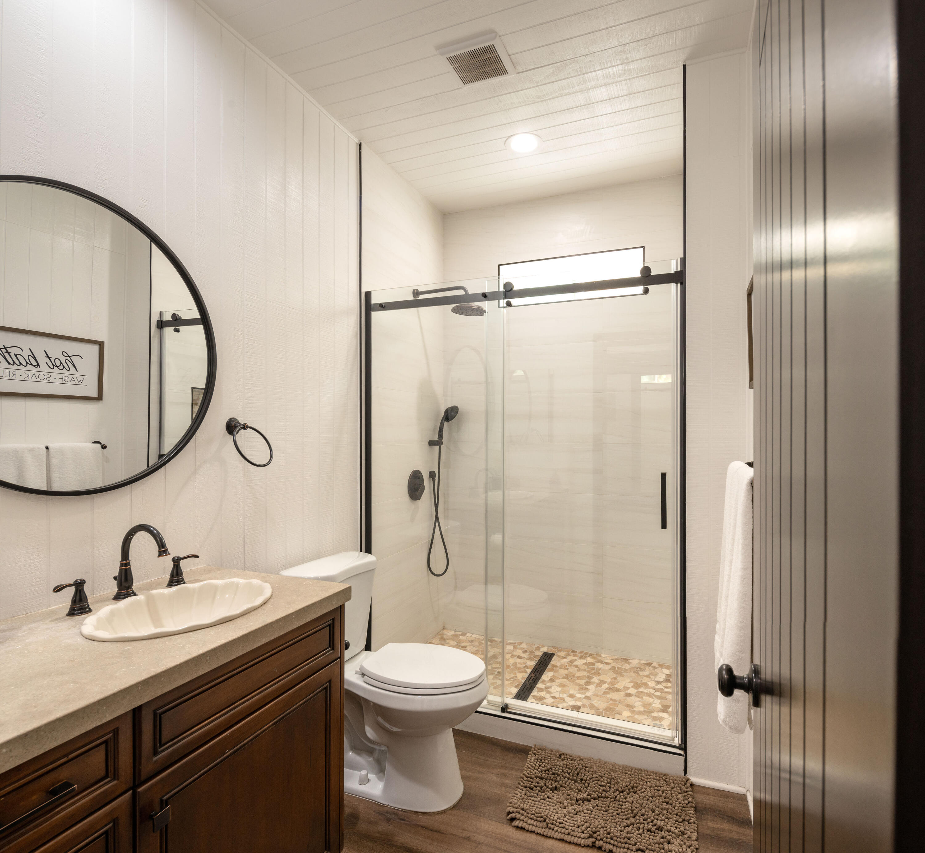 67195 Springcrest Drive Mountain Center, CA 92561 - Photo 55 of 67 a bathroom with a toilet a sink and a mirror