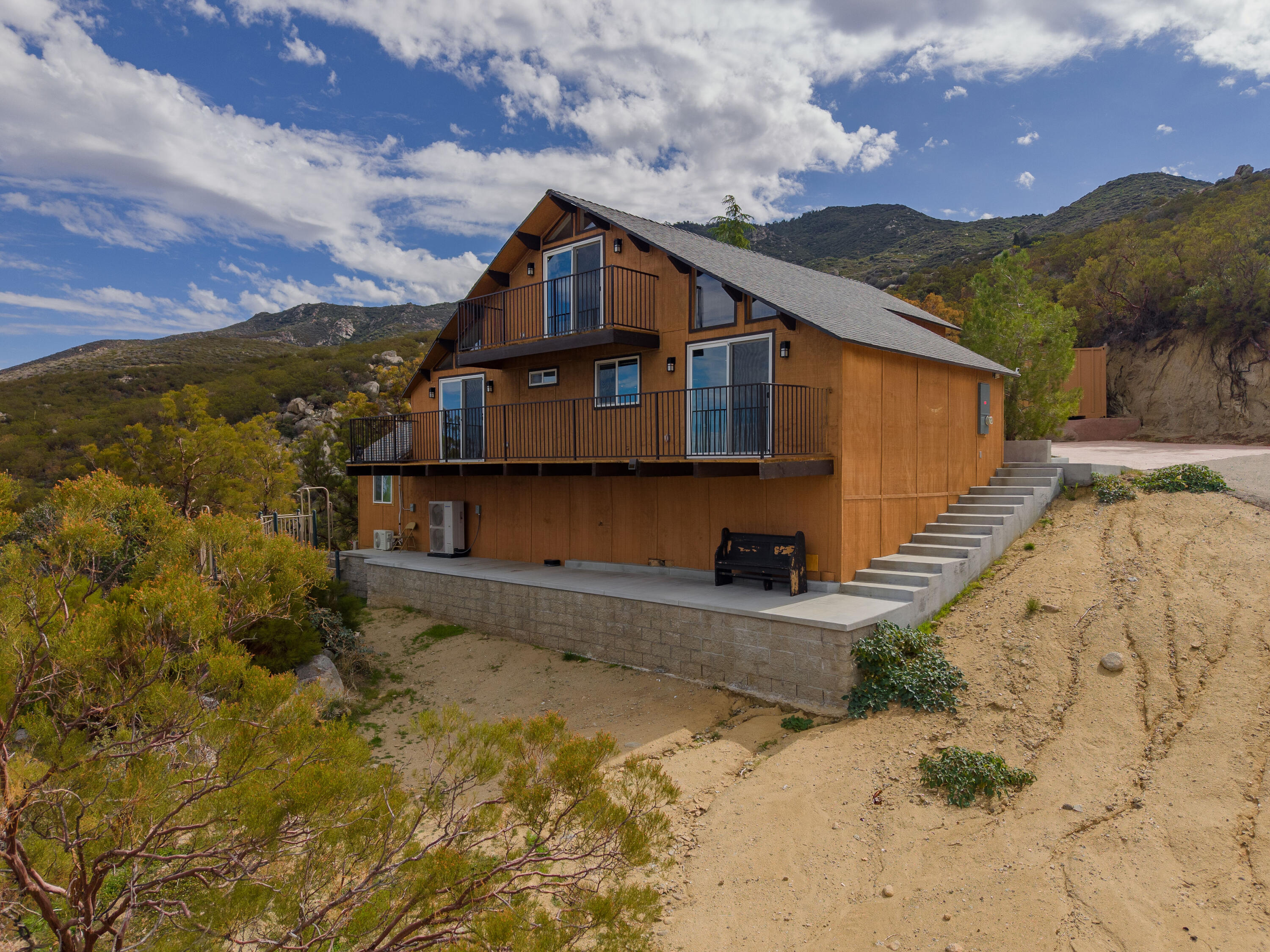 67195 Springcrest Drive Mountain Center, CA 92561 - Photo 6 of 67 a front view of a house with a yard