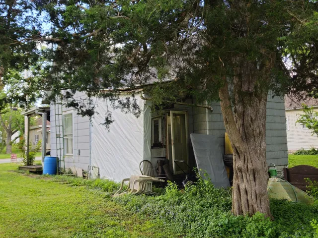 a backyard of a house with lots of green space