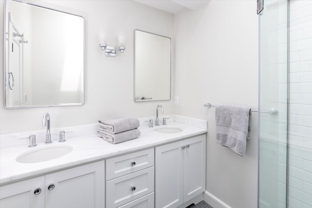 62 Chestnut Street Boston, MA 02108 - Photo 17 of 18 a bathroom with a granite countertop sink and a mirror