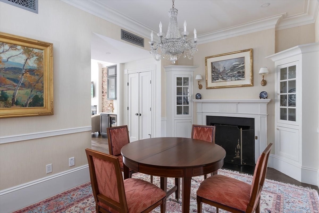 62 Chestnut Street Boston, MA 02108 - Photo 8 of 18 a view of a dining room with furniture wooden floor and chandelier
